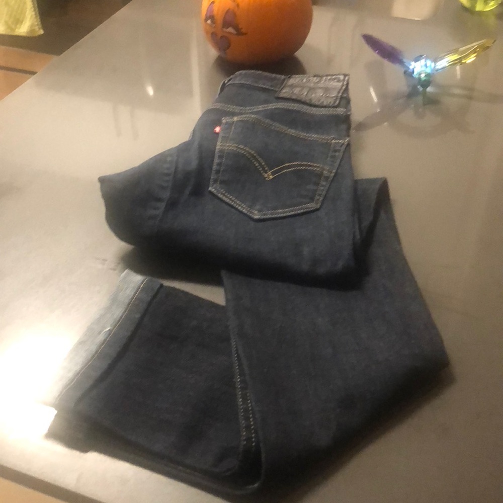 Black button levi jeans.